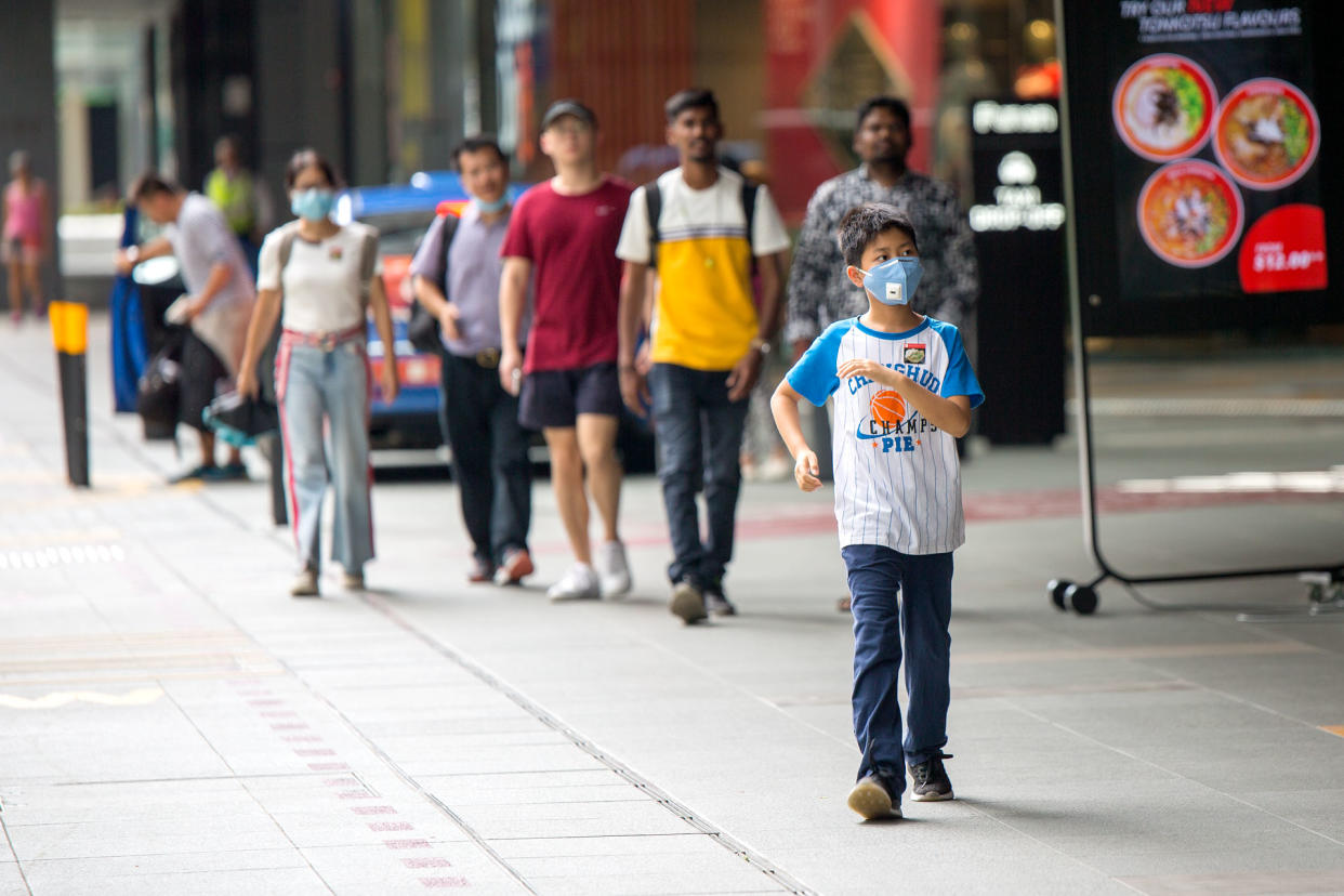 A young boy wearing a face mask seen outside the Funan Mall on Monday (27 January). (PHOTO: Dhany Osman / Yahoo News Singapore)