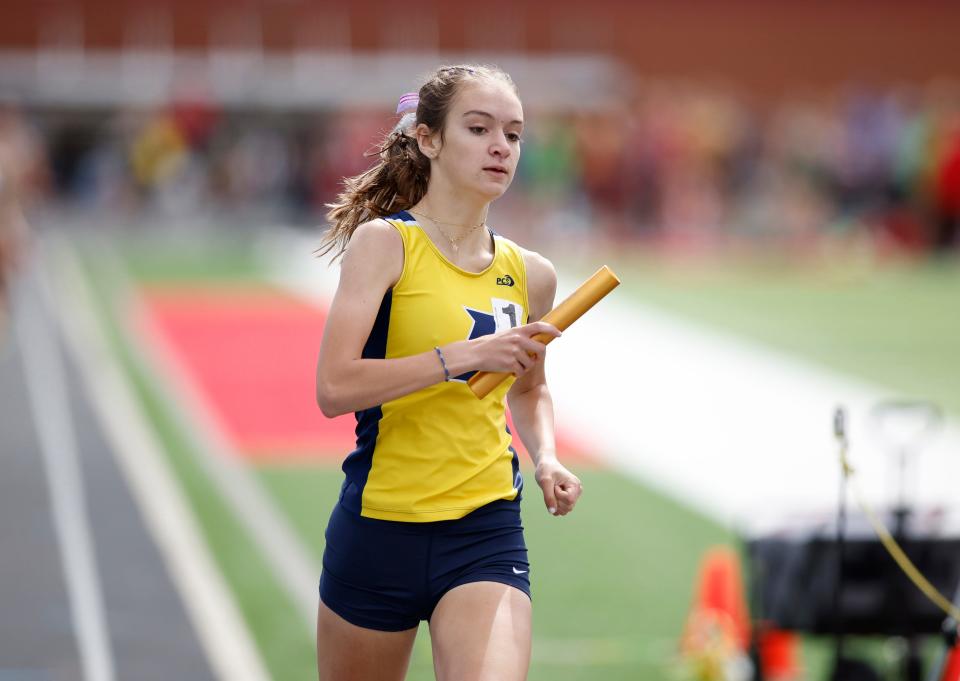 Ithaca's Lani Bloom runs in the 4x800 meter relay, Saturday, June 4, 2022, at Kent City High School. Bloom, a Purdue signee, won both the 800 and 1,600 meter races.