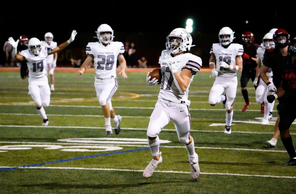 Sep 23, 2022; Scottsdale, Arizona, USA; Desert Mountain Wolves wide receiver Ryan McDonough (17) runs for a touchdown against the Chaparral Firebirds during a game played at Chaparral High. Mandatory Credit: Rob Schumacher-Arizona Republic