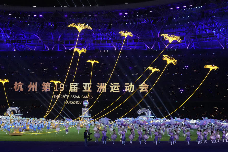 Performers take part in the closing ceremony of the 19th Asian Games in Hangzhou, China, Sunday, Oct. 8, 2023. (AP Photo/Eugene Hoshiko)