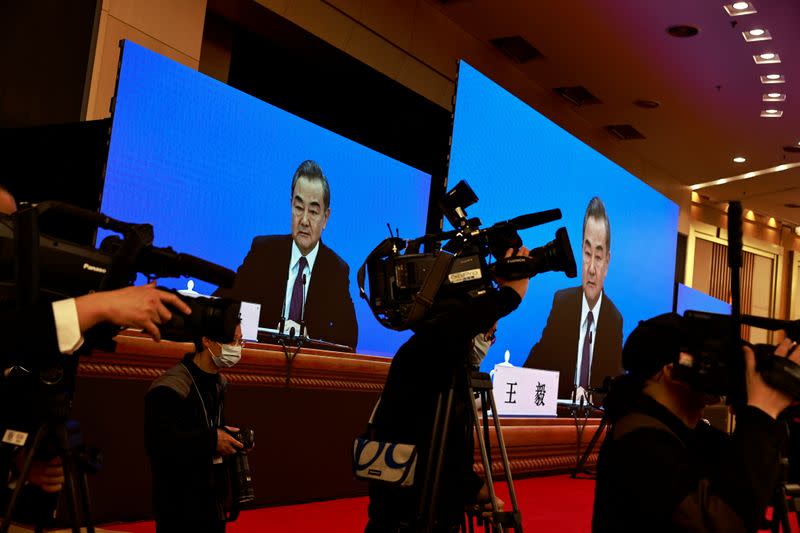 Chinese State Councillor and Foreign Minister Yi attends a news conference in Beijing