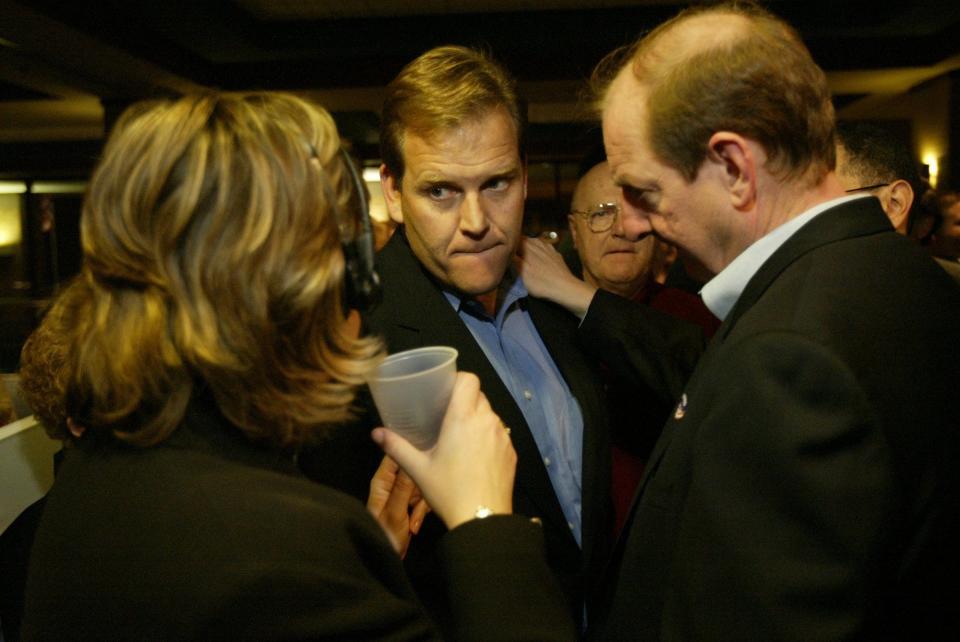 U.S. Congressional candidate Mike Rogers, center, talks with Republican organizers Tuesday evening, Nov. 5, 2002, before giving an early acceptance speech at the Radisson Hotel in Lansing, Michigan.