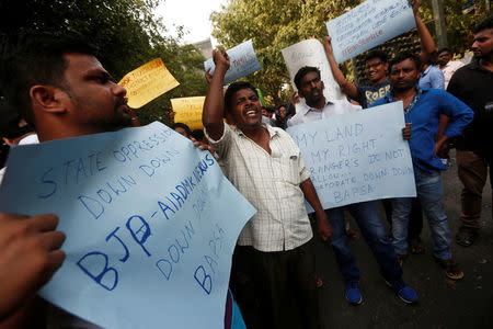 People shout slogans outisde the Tamil Nadu House during a protest, after at least 10 people were killed when police fired on protesters seeking closure of plant on environmental grounds in town of Thoothukudi in Tamil Nadu, in New Delhi, May 23, 2018. REUTERS/Adnan Abidi/Files