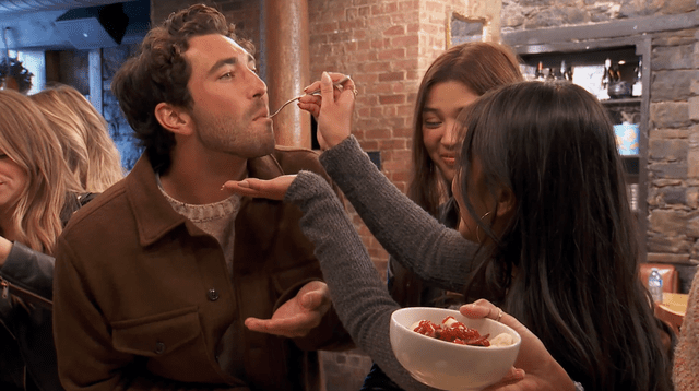 <p>ABC</p> Joey takes a bite of Jenn's dish on 'The Bachelor'