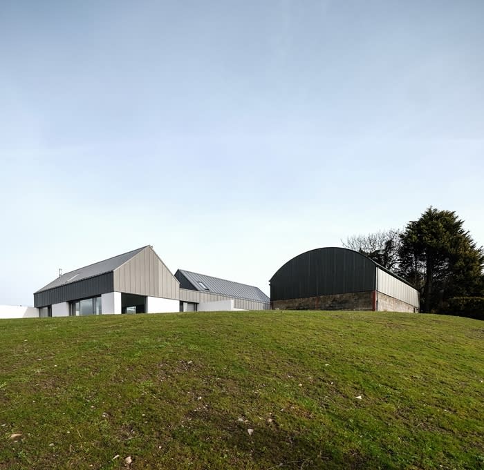 House Lessans in County Down, Northern Ireland, sits next to an existing barn and has a separate bedroom block with private courtyard and living spaces which look out onto a green rolling landscape. (Picture: Aidan McGrath)