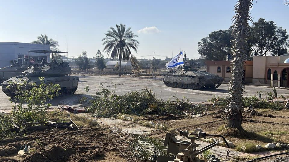 This photo provided by the Israel Defense Forces shows a tank with an Israel flag on it entering the Gazan side of the Rafah border crossing on Tuesday. - IDF/AP