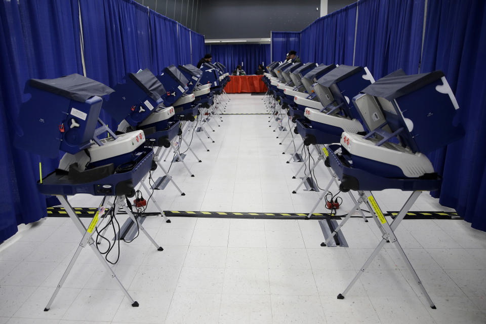 FILE - In this March 13, 2018, file photo, voters cast their ballots in Illinois primary elections at the city's new early voting super site in downtown Chicago. With the presidential primaries less than a year away, security experts and elected officials have expressed concern about whether the state and federal governments have done enough since 2016 to fend off another attack by Russia or other foreign actors. (AP Photo/Kiichiro Sato, File)