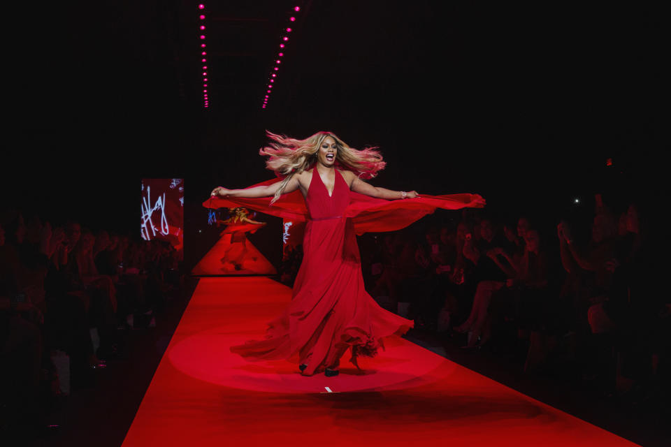 Actress Laverne Cox walks in a Donna Karan creation during a presentation of the Go Red for Women Red Dress collection during New York Fashion Week on Feb. 13, 2015.