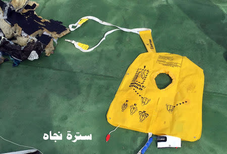 Recovered debris of the EgyptAir jet that crashed in the Mediterranean Sea is seen with the Arabic caption "life jacket" in this handout image released May 21, 2016 by Egypt's military. Egyptian Military/Handout via Reuters