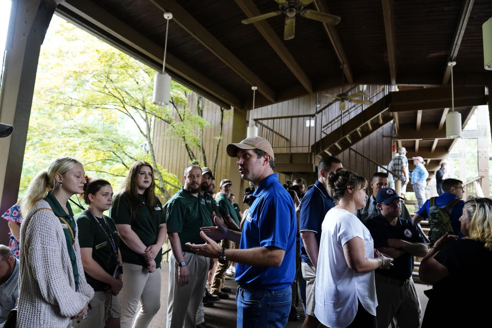 Kentucky Governor Andy Beshear, center, talks with residents that have been displaced by floodwaters at Jenny Wiley State Resort Park Saturday, Aug. 6, 2022, in Prestonsburg, Ky. (AP Photo/Brynn Anderson)