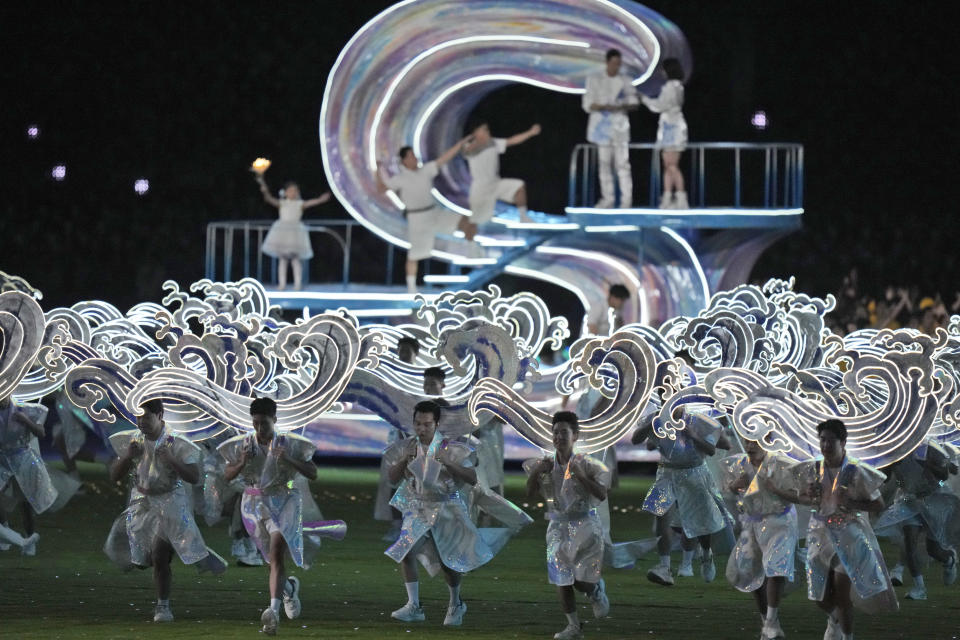 Performers take part in the closing ceremony of the 19th Asian Games in Hangzhou, China, Sunday, Oct. 8, 2023. (AP Photo/Eugene Hoshiko)