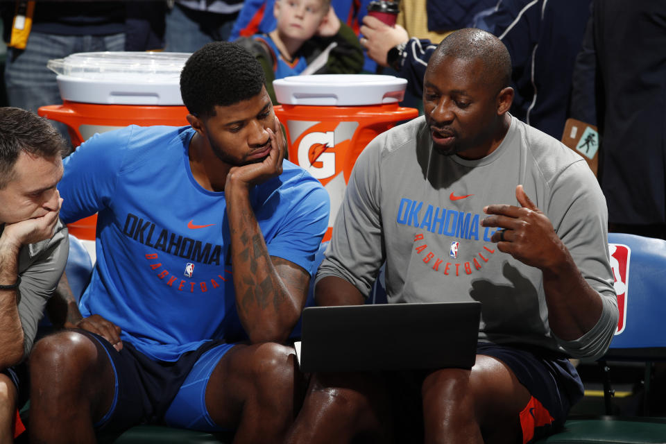 Adrian Griffin, right, works with the Thunder’s Paul George in December. (Getty)