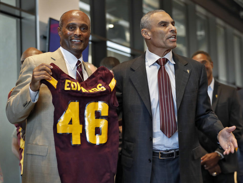 Newly appointed Arizona State University head coach Herman Edwards (R) with Athletic Director Ray Anderson. (AP Photo/Matt York)