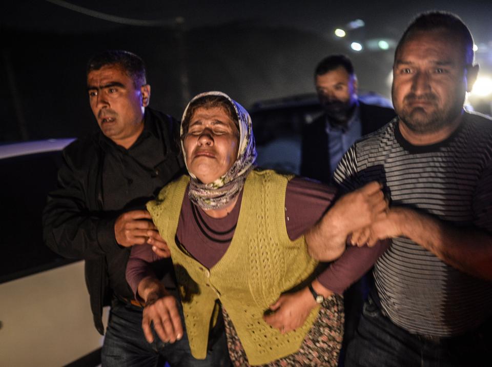 People cry after their relatives died in an explosion in Manisa on May 13, 2014. (BULENT KILIC/AFP/Getty Images)