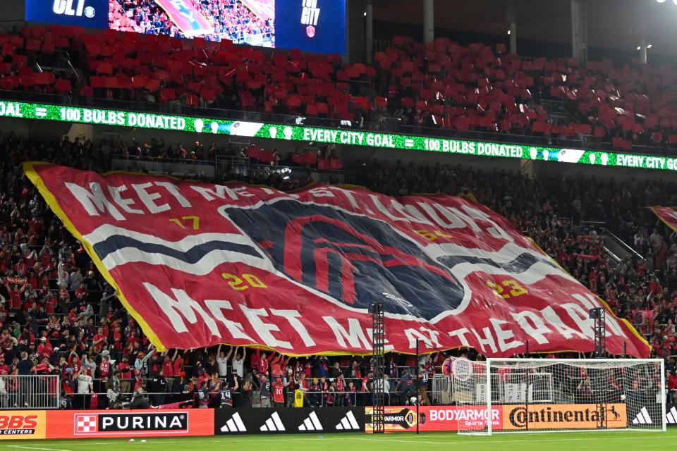 March 4, 2023: St. Louis City SC fans unfurl a tifo before the game against Charlotte FC at CITYPARK. St. Louis City SC won, 3-1, in the team's first-ever home game.
