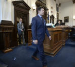 Kyle Rittenhouse, center, walks into the courtroom with attorney Corey Chirafisi for a motion hearing in Kenosha, Wis., on Friday, Sept. 17, 2021. (Sean Krajacic/The Kenosha News via AP)