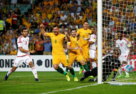 Football Soccer - Australia vs United Arab Emirates - 2018 World Cup Qualifying Asian Zone - Group B - Sydney Football Stadium, Sydney, Australia - 28/3/17 - Australia's Bailey Wright, Mathew Leckie and Tomi Juric celebrate after teammate Jackson Irvine (unseen) scored a goal against the UAE. REUTERS/David Gray