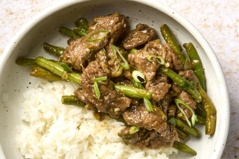 garlic beef stir fry in bowl with white rice