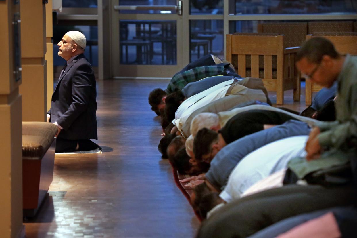 Imad Enchassi leads prayers as Muslims and elected leaders attend the Council on American-Islamic Relations-Oklahoma's (CAIR-OK) 2023 Ramadan Iftar for elected leaders at the Oklahoma History Center in Oklahoma City.