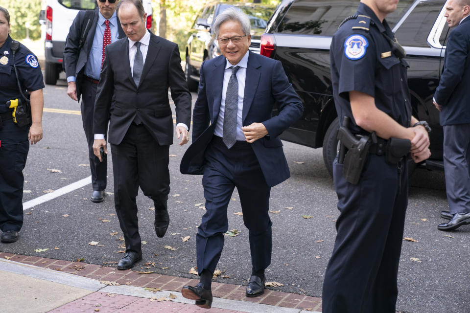 Nvidia CEO Jensen Huang, center, arrives for a closed-door gathering of leading tech CEOs to discuss the priorities and risks surrounding artificial intelligence and how it should be regulated, on Capitol Hill in Washington, Wednesday, Sept. 13, 2023.(AP Photo/Jacquelyn Martin)
