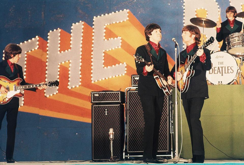 The Beatles perform at Budokan Hall in Tokyo, Japan for the first time, June 30, 1966. From left: George Harrison, Paul McCartney, John Lennon and Ringo Starr. (AP Photo)