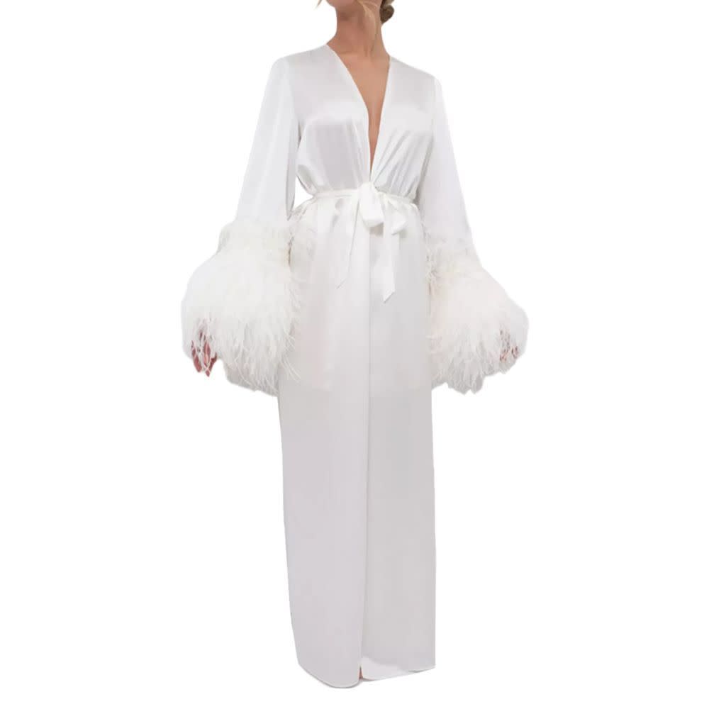 <p><a href="https://go.redirectingat.com?id=74968X1596630&url=https%3A%2F%2Fwww.macys.com%2Fshop%2Fproduct%2Fwomens-silk-long-robe-double-ostrich-feather-sleeve-trim-silk-collection%3FID%3D16658507&sref=https%3A%2F%2Fwww.elle.com%2Ffashion%2Fshopping%2Fa60246725%2Feditor-bridal-wedding-outfits%2F" rel="nofollow noopener" target="_blank" data-ylk="slk:Shop Now;elm:context_link;itc:0;sec:content-canvas" class="link rapid-noclick-resp">Shop Now</a></p><p>Silk Long Robe, Double Ostrich Feather Sleeve Trim</p><p>macys.com</p><p>$828.00</p>