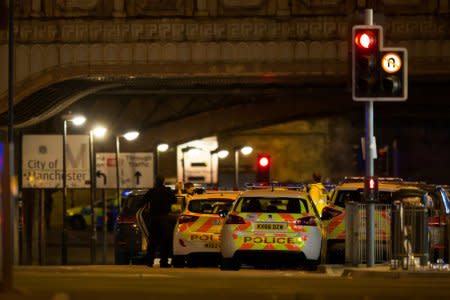 Police officers are seen outside the Manchester Arena. REUTERS/Jon Super