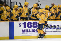 Nashville Predators right wing Rocco Grimaldi (23) is congratulated after scoring a goal against the Carolina Hurricanes during the first period of an NHL hockey game Monday, May 10, 2021, in Nashville, Tenn. (AP Photo/Mark Zaleski)