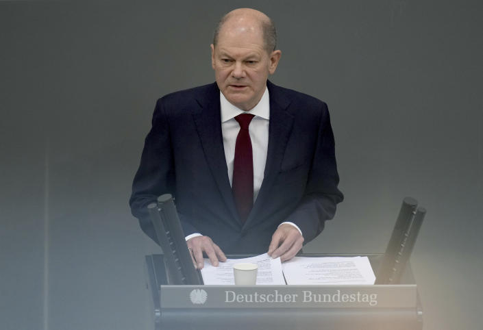 German Chancellor Olaf Scholz delivers a speech on the Russian invasion of the Ukraine during a meeting of the German federal parliament, Bundestag, at the Reichstag building in Berlin, Germany, Sunday, Feb. 27, 2022. (AP Photo/Michael Sohn)