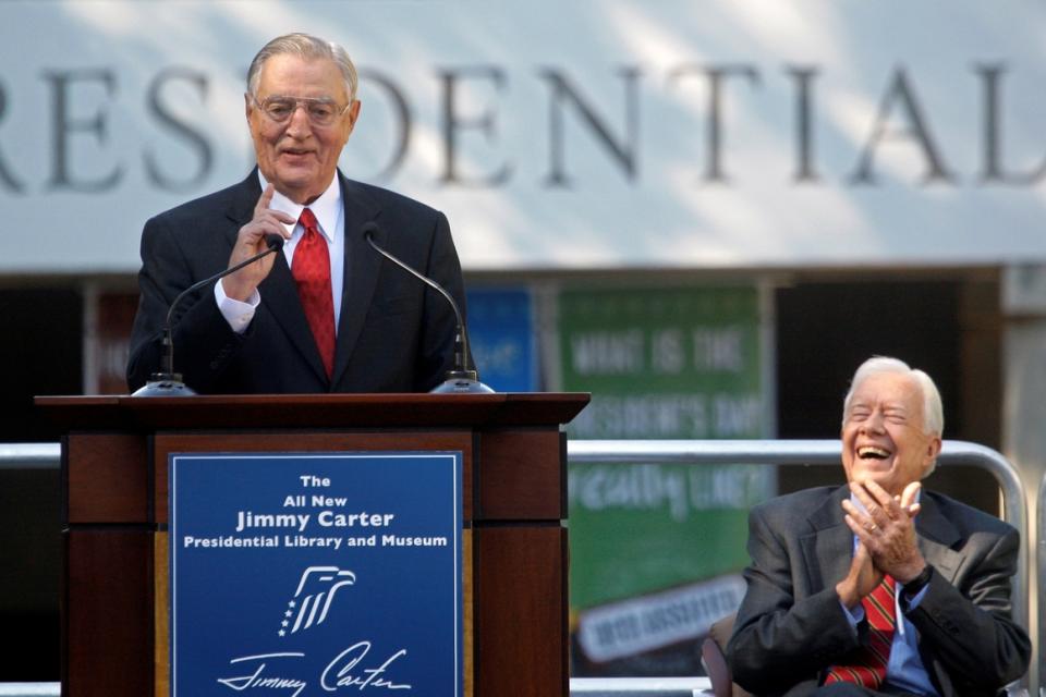 Walter Mondale speaks at a ceremony at the Carter Presidential Library in Atlanta in 2009 as former President Jimmy Carter looks on.   