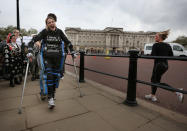 LONDON, ENGLAND - MAY 08: Claire Lomas shouts with joy as she passes Buckingham Palace as she walks the last mile of the Virgin London Marathon on May 8, 2012 in London, England. Ms Lomas, who is paralysed from the waist down after a riding accident in 2007, has taken 16 days to complete the 26.2 mile route. Starting out with 36,000 other runners she has averaged 2 miles a day with the help of a bionic ReWalk suit. (Photo by Peter Macdiarmid/Getty Images)