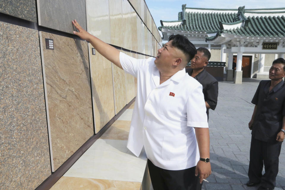North Korean leader Kim Jong Un provides field guidance during his visit to the Chollima Tile Factory in August of 2014.&nbsp;