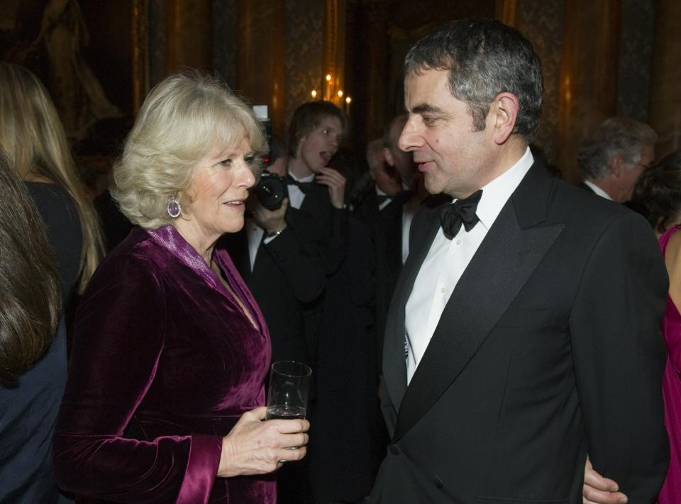 LONDON - FEBRUARY 1:  Camilla, Duchess of Cornwall talks with actor/comedian Rowan Atkinson as she at a charity gala dinner and theatrical performance for supporters of the The Prince's Foundation for Children and the Arts at Buckingham Palace on February 1, 2011 in London, England.  (Photo by Arthur Edwards/WPA Pool/Getty Images)