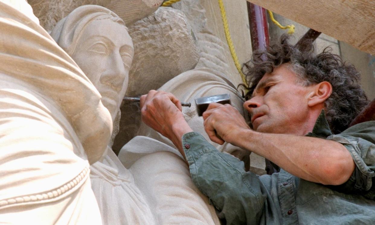 <span>Simon Verity at work in 1996 on the facade of the Cathedral of St John the Divine in New York.</span><span>Photograph: NY Daily News/Getty Images</span>