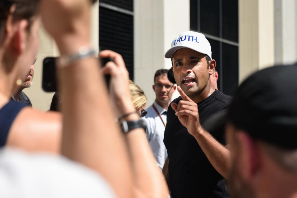 2024 Republican presidential candidate Vivek Ramaswamy speaks to media outside a federal courthouse.