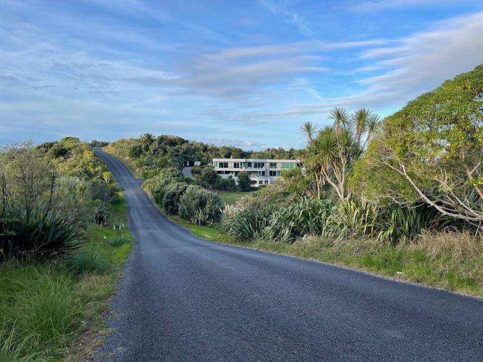 A view of a mansion and road on Waiheke Island, New Zealand.