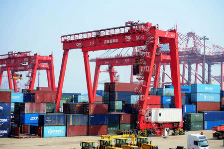 Container boxes are seen at a port in Qingdao, Shandong province, China, April 17, 2017. China Daily/via REUTERS