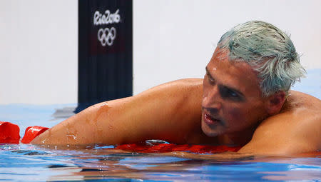 2016 Rio Olympics - Swimming - Final - Men's 200m Individual Medley Final - Olympic Aquatics Stadium - Rio de Janeiro, Brazil - 11/08/2016. Ryan Lochte (USA) of USA reacts. REUTERS/David Gray