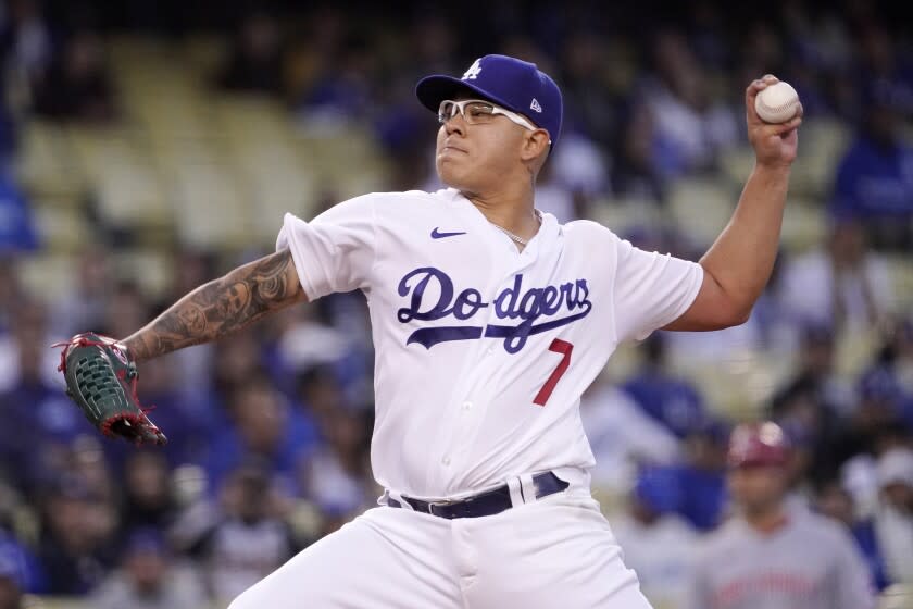 Los Angeles Dodgers starting pitcher Julio Urias throws to the plate during the first inning.