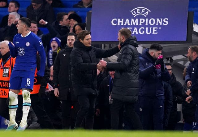 Edin Terzic, centre left, congratulates Graham Potter after Chelsea's win