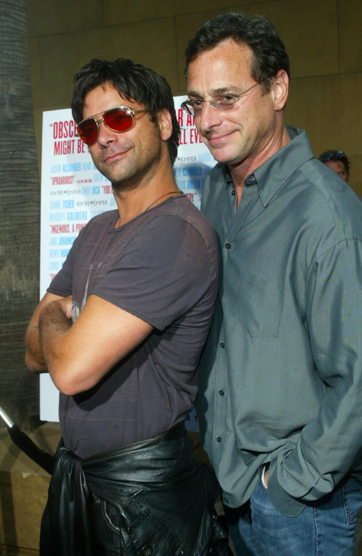 Actors John Stamos and Bob Saget arrive at the Los Angeles premiere of the "The Aristocrats" at The Egyptian Theatre in Hollywood, Calif. on July 20, 2005.