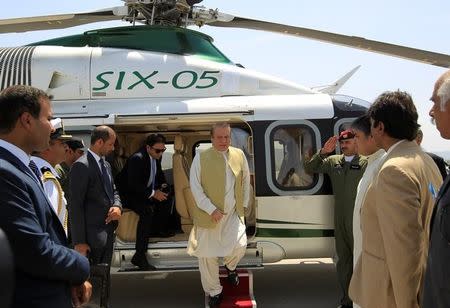 Pakistani Prime Minister Nawaz Sharif disembarks from his helicopter at the newly built airport in Islamabad, Pakistan May 6, 2017. REUTERS/Caren Firouz