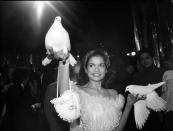 <p>Yes, those are doves Bianca Jagger is holding. The fashionista celebrates her birthday with an over-the-top celebration at Studio 54. </p>