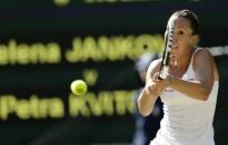 Jelena Jankovic of Serbia hits a shot during her match against Petra Kvitova of the Czech Republic at the Wimbledon Tennis Championships in London, July 4, 2015. REUTERS/Henry Browne