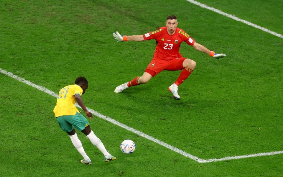 Argentina's Emiliano Martinez in action as he saves a shot from Australia's - Reuters