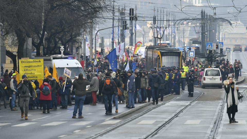 Participants gather at the Jaszai Mari Square during the demonstration of the Hungarian Trade Union Confederation in Budapest, Hungary, Saturday, Dec. 8, 2018. The protest was held against planned 50 days overwork in a year and for freedom of scientific research and the freedom of education. (Zsolt Szigetvary/MTI via AP)