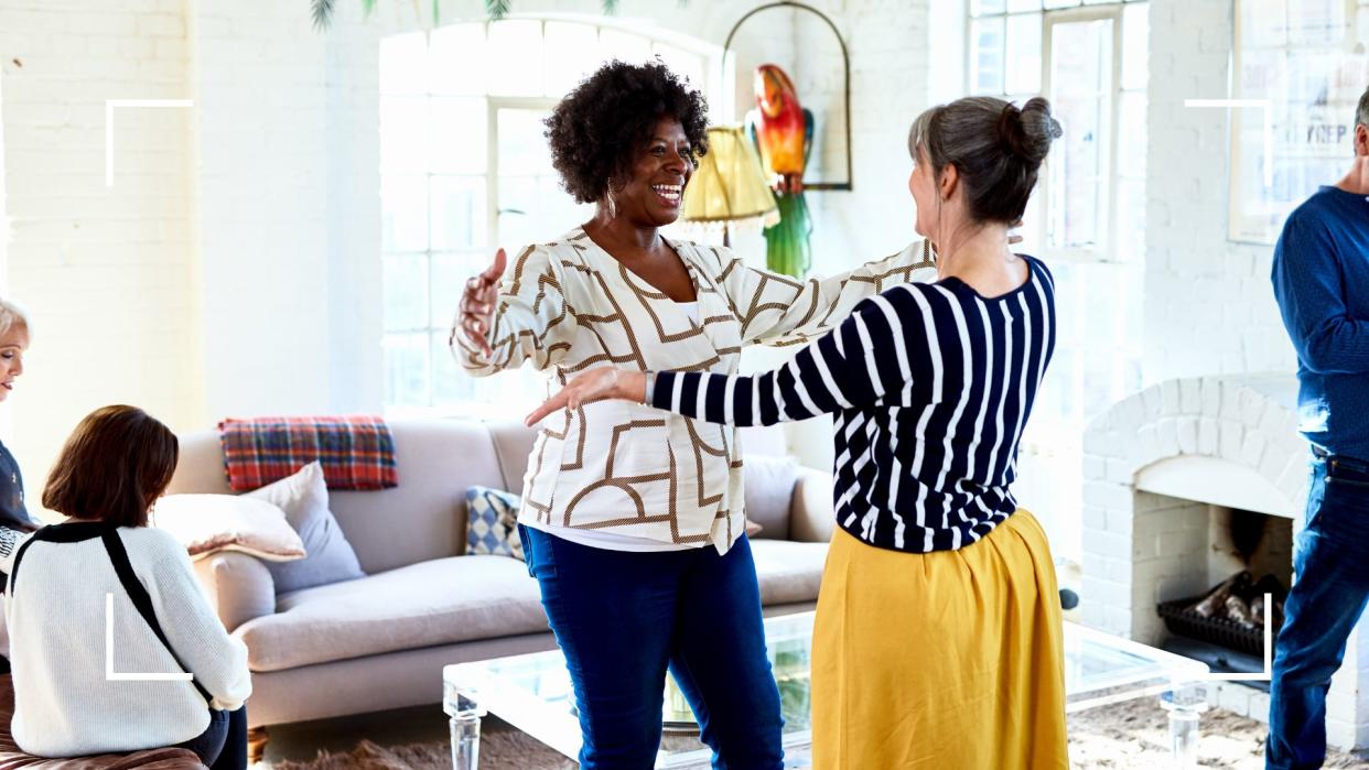  Two women about to embrace each other in social situation, representing the benefits of not drinking alcohol. 