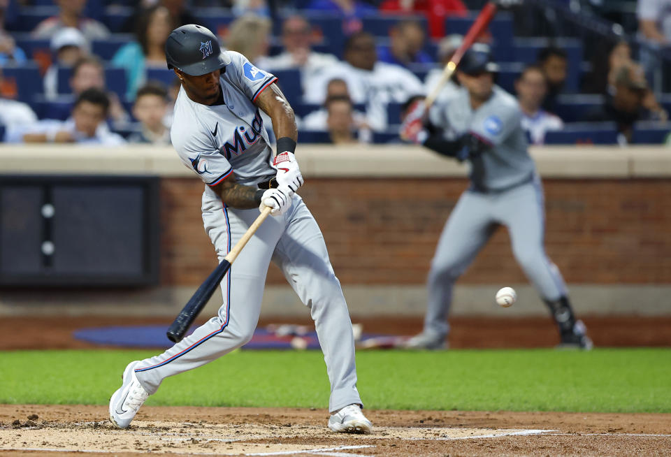 Miami Marlins shortstop Tim Anderson (7) hits an RBI single against the New York Mets during the second inning of a baseball game, Tuesday, June 11, 2024, in New York. (AP Photo/Noah K. Murray)