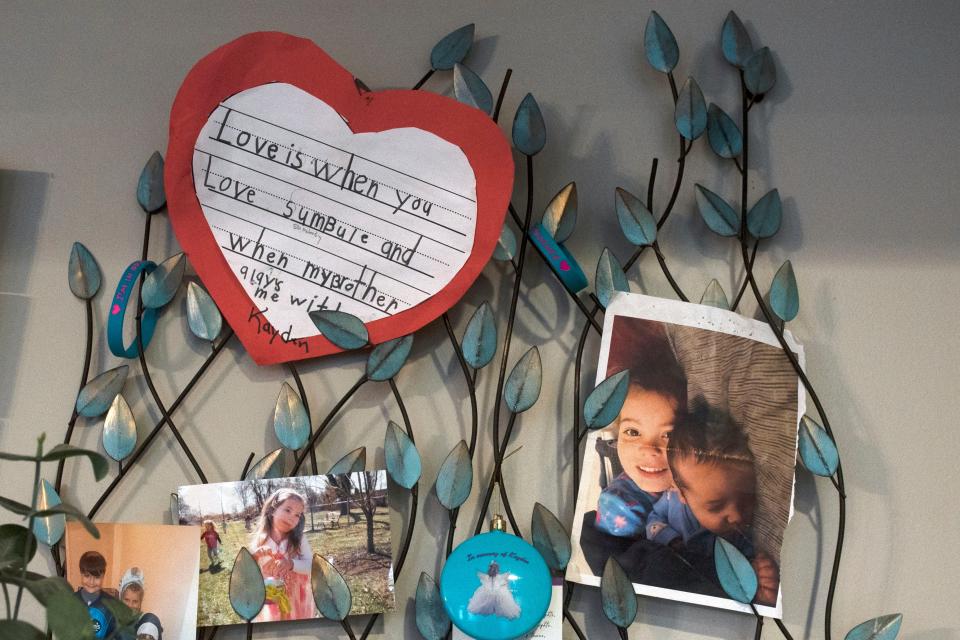 The memories of Kathryn Sherlock's daughter Kayden Mancuso who was murdered in 2018 hang on the kitchen wall at her house in Yardley on Monday, Dec. 6, 2021. Kathryn Sherlock has been advocating for Senate Bill 78, which was prompted by the murder of her daughter Kayden Mancuso by the child's biological father, that aims to prioritize a child's safety and welfare over parental rights.