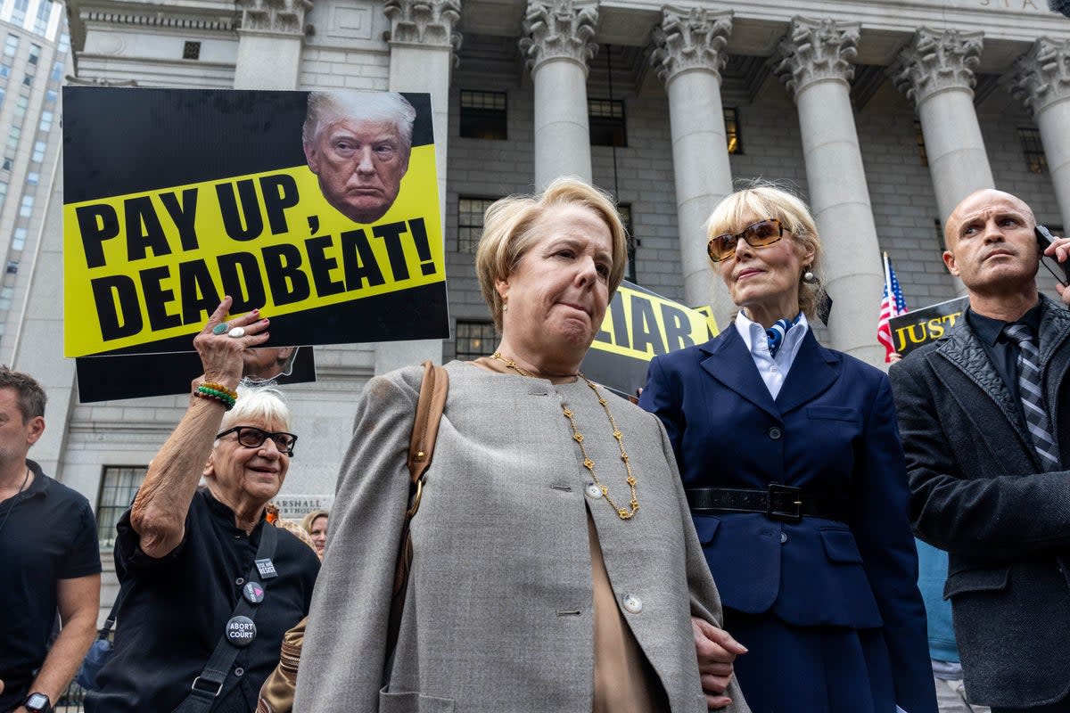 Protesters surround E Jean Carroll and her attorney Roberta Kaplan as they leave a federal courthouse on September 6 following an appeals court hearing in a defamation case against Donald Trump (Getty Images)